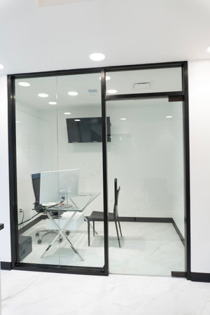 Interior of modern office, glass door and white marble floor.の写真素材