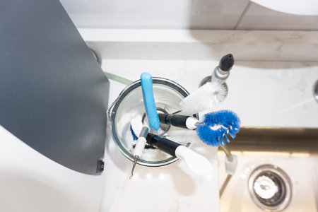 Brush in a washbasin in a modern bathroom.の写真素材