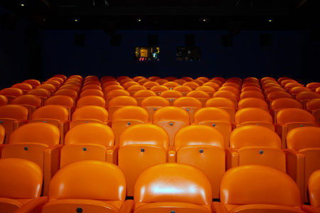 Orange seats in the auditorium of the theater, cinema or theaterの写真素材