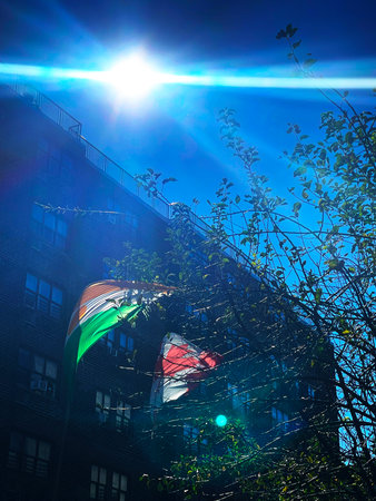 Flag of the United Arab Emirates on the facade of a residential buildingの写真素材