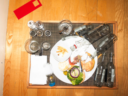 Dinner table with food and drinks on wooden table. Top viewの写真素材