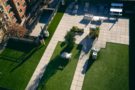 Aerial view of a patio with sunbeds and umbrellasの写真素材