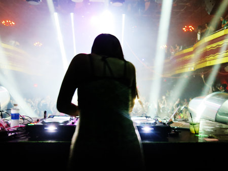 Dj mixes the track in the nightclub at a party. Nightlifeの写真素材