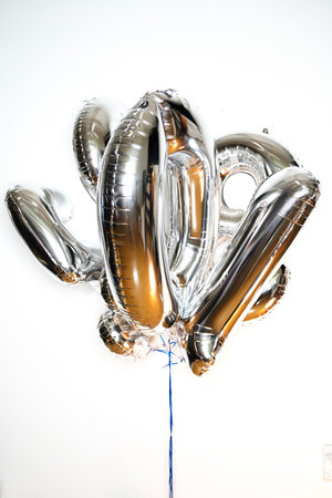 Silver balloons in the shape of the number 2019 on a white backgroundの写真素材