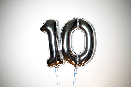 Number 10 silver foil balloon isolated on white background. Birthday or anniversary celebration decoration.の写真素材