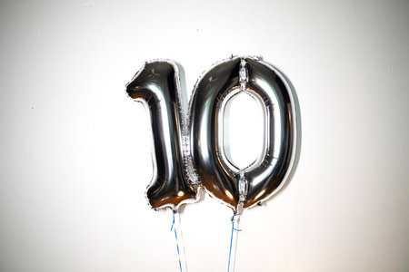 Number 10 silver balloon on a white background. Birthday or anniversary celebration.の写真素材