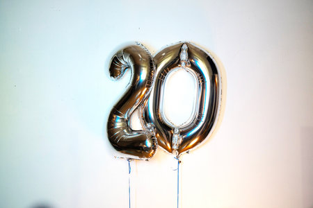 20 years silver balloon number on white background. 20th birthday celebration.の写真素材