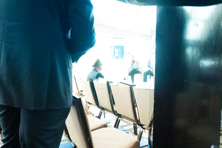 Businessman in the conference hall, back view. Business and education concept