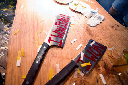 High angle view of knife on table during birthday party in barbershop