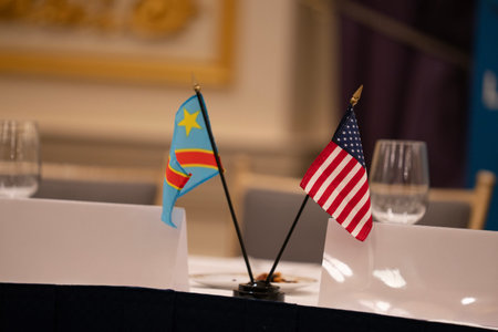 Flags of the USA and Congo Democratic Republic on a table in a restaurantの写真素材