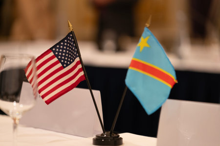 Flags of the USA and Congo Democratic Republic on a table in a restaurant