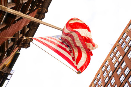 American flag waving in the wind in New York City, USA.の写真素材