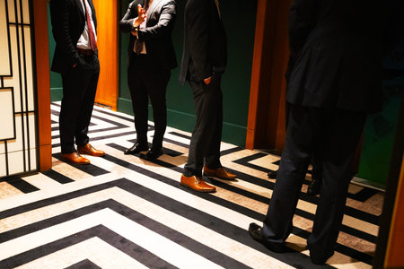 Business people walking in corridor of modern office building.