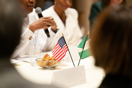 Close-up of a microphone and a plate with bread on the table during an eventの写真素材