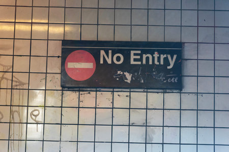 No entry sign on a wall of a metro station in Paris, France