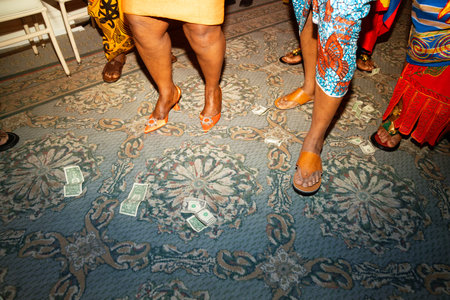 people wearing traditional clothes walking on the floor in a restaurant