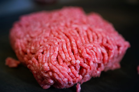 minced meat on a black background. Raw minced meat on a black background