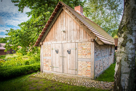 a pretty garden house in a dreamlike idyllの写真素材