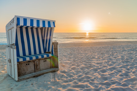 Beach chair in the sunsetの写真素材