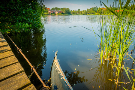Damaged boat on a lakeの写真素材