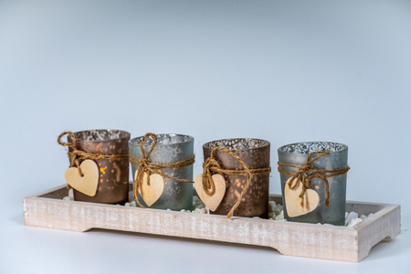 four candlesticks decorated with a heartの写真素材