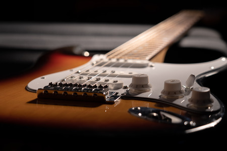 Close-up of a sunburst electric guitarの写真素材