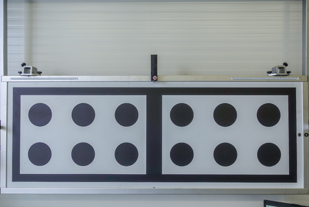 a light test panel in a car repair shop