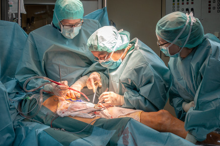two surgeons perform a vascular operationの写真素材