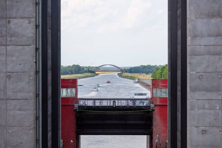 ships are leaving a gigantic ship's hoistの写真素材