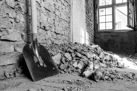 in laborious work an old house is restoredの写真素材