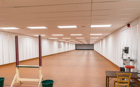 in a large indoor shooting range can train sport shootersの写真素材