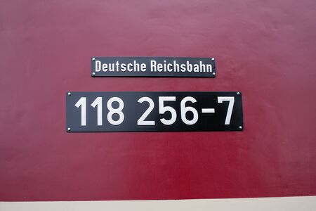 an old historical train of the Deutsche Reichsbahn from the times of the GDR stands on a sidingの写真素材