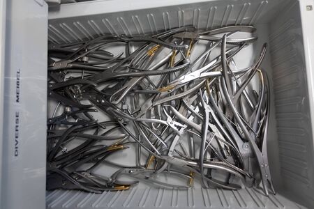 in a sterilization department in a hospital are many replacement instruments in a drawerの写真素材