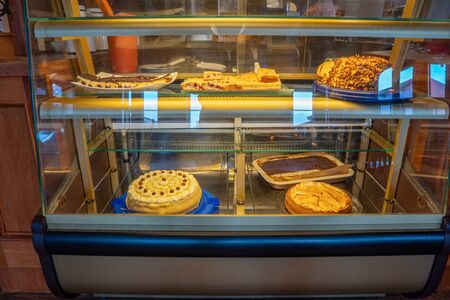 in a display of a baker different cakes and tarts are combinedの写真素材