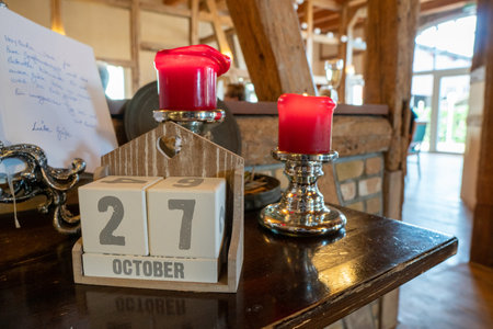 on a sideboard there are candlesticks and a calendar showing 27 Octoberのeditorial素材
