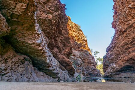 in the Australian outback there is a rugged rock formation called Simpsons Gabの写真素材