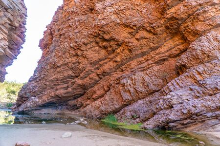in the Australian outback there is a rugged rock formation called Simpsons Gabの写真素材