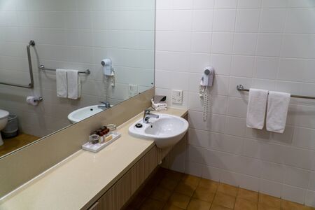 a clean and neatly furnished bathroom in an Australian hotelの写真素材