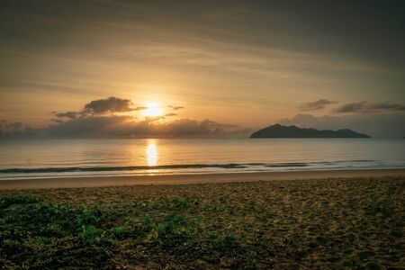a sunrise at the paradisiacal beach of Mission Beach in the north of Australiaの写真素材