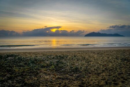 a sunrise at the paradisiacal beach of Mission Beach in the north of Australiaの写真素材