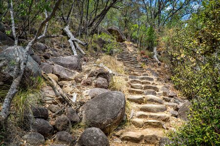 a staircase made of natural stone leads up a mountain in Australiaの写真素材
