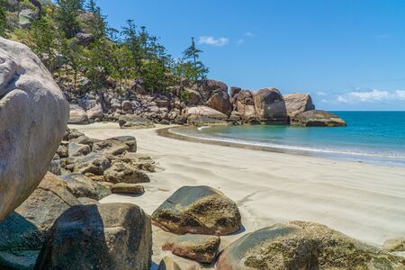 the paradisiacal beach with blue water of Magnetic Island in the northwest of Australiaの写真素材