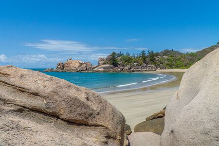 the paradisiacal beach with blue water of Magnetic Island in the northwest of Australiaの写真素材