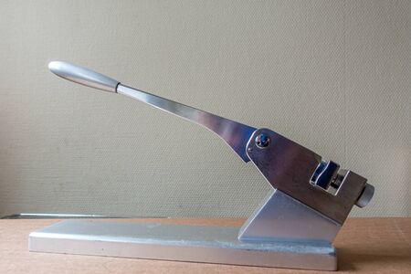 on a silver table stands a bending press for bending surgical metal platesの写真素材