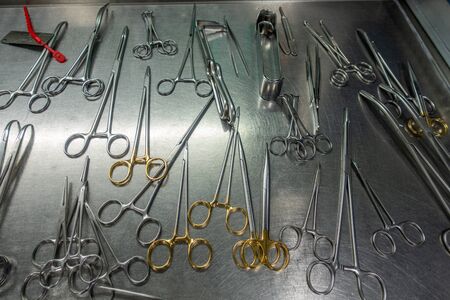 on a metal table there are various washed instruments for performing an operationの写真素材