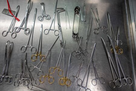 on a metal table there are various washed instruments for performing an operationの写真素材