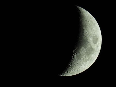 The term increasing crescent moon is used to describe the period after a new moon in which less than half of the illuminated half of the moon is visible from Earth. This transition moon phase ends with the increasing half moon, also called first quarterの写真素材