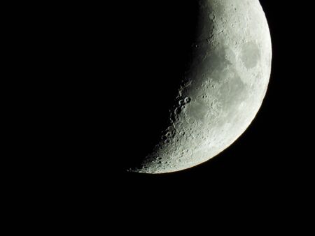 The term increasing crescent moon is used to describe the period after a new moon in which less than half of the illuminated half of the moon is visible from Earth. This transition moon phase ends with the increasing half moon, also called first quarterの写真素材