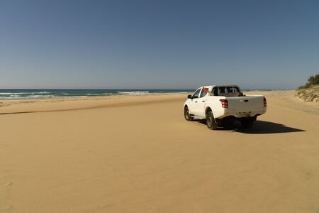 there's a white pickup truck on Fraser Island beach.の写真素材