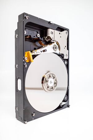 a screwed-on hard disk shows the inner workings of a hard diskの写真素材